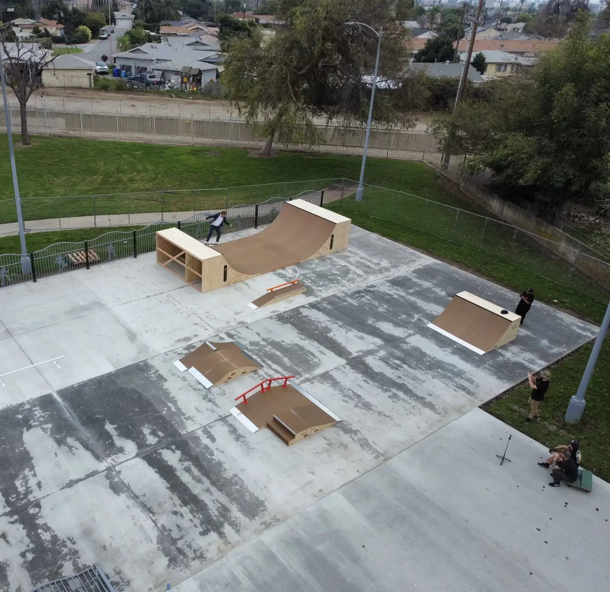 Completed community skatepark with multiple wooden ramps and rails, in Ravenswood, West Virginia.