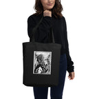 Person carrying the black Fulgore Demon tote bag over one shoulder