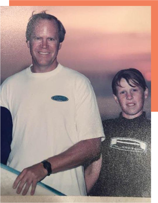 Tyler with his dad in an archival family photograph