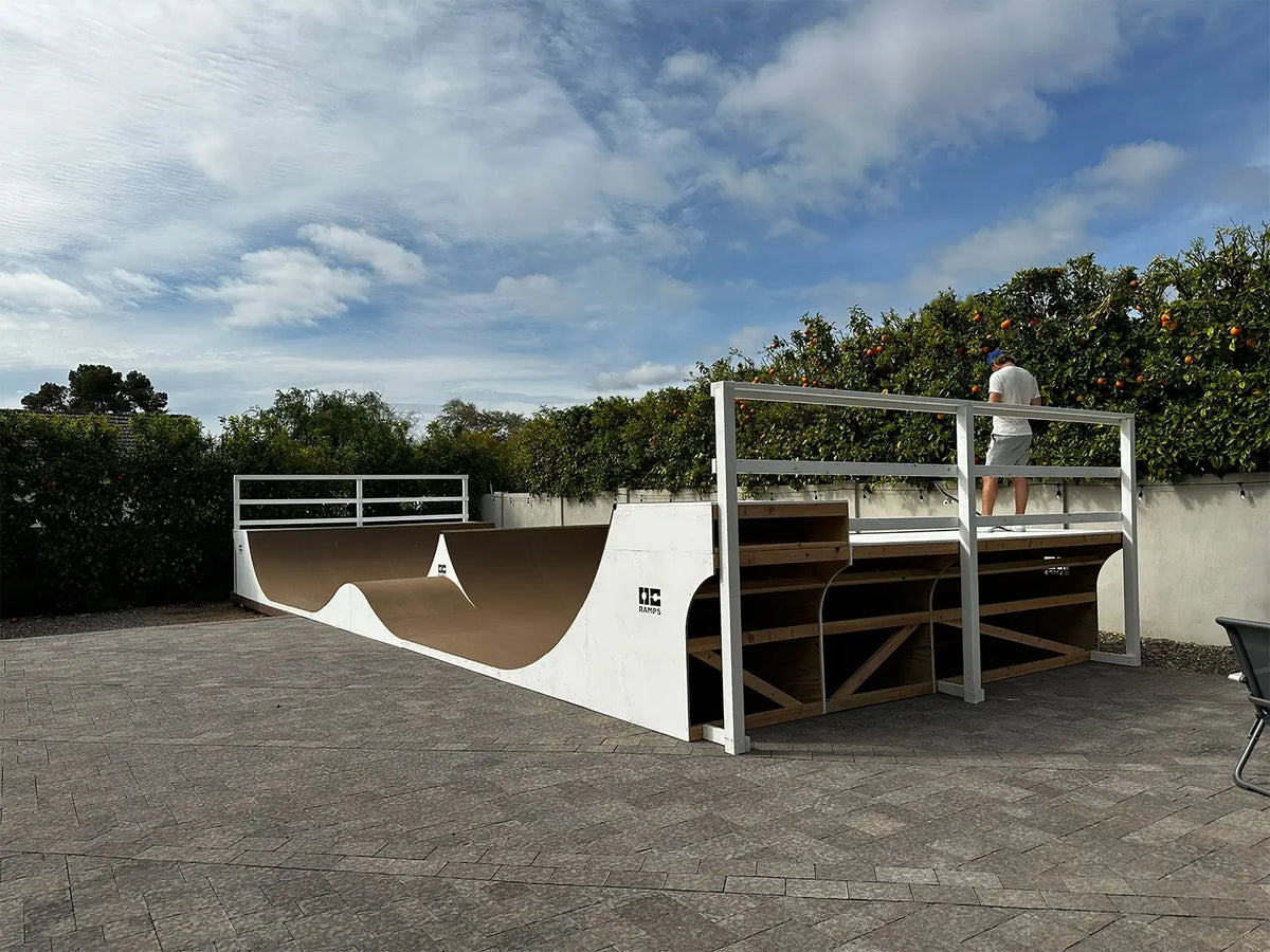 In-ground backyard mini ramp with a white and brown wavy design, in Las Vegas, Nevada
