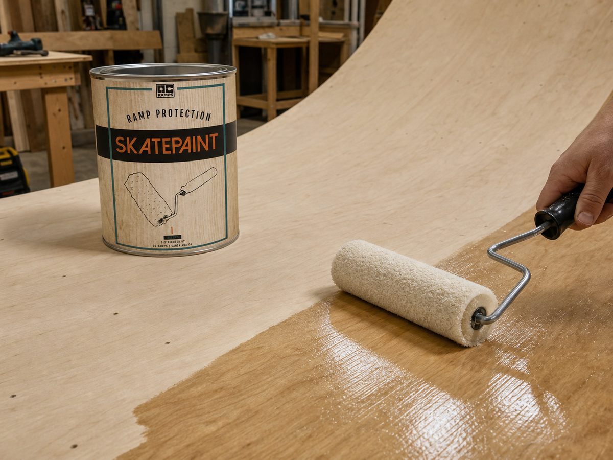Regular nap roller applying OC Ramps Skate Paint to a wooden ramp