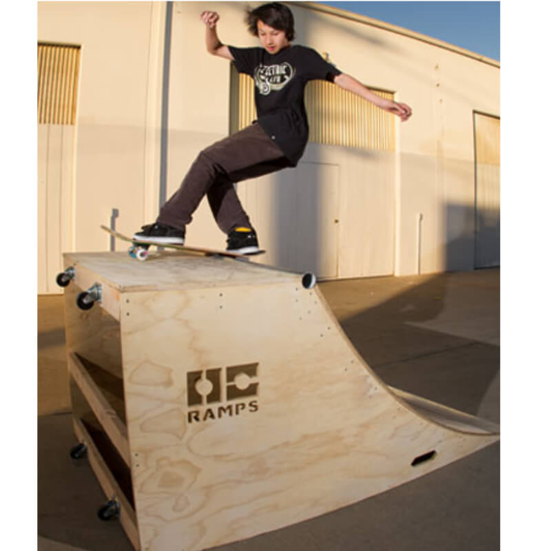 OC Ramps Quarter Pipe Ramps – Two 4 Foot — action shot with skater — backyard quarter pipe ramp kit