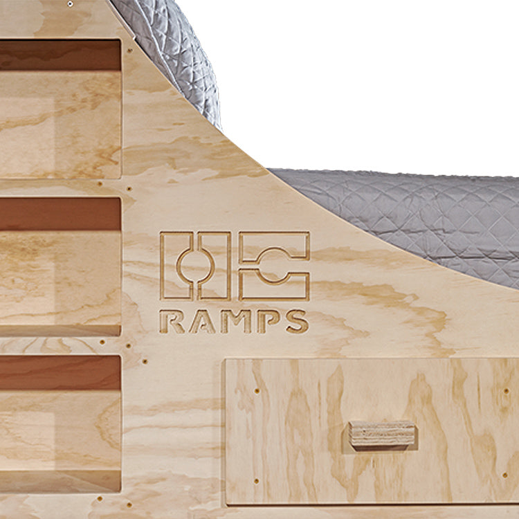 OC Ramps half pipe bed up close angle with logo, drawer, and shelves