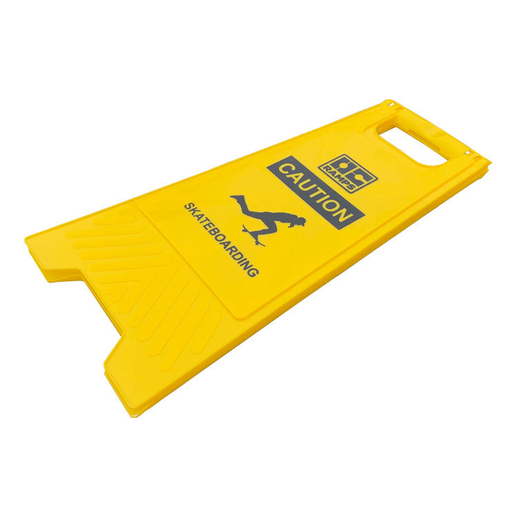 Yellow OC Ramps Caution Skateboarding sign folded flat for storage