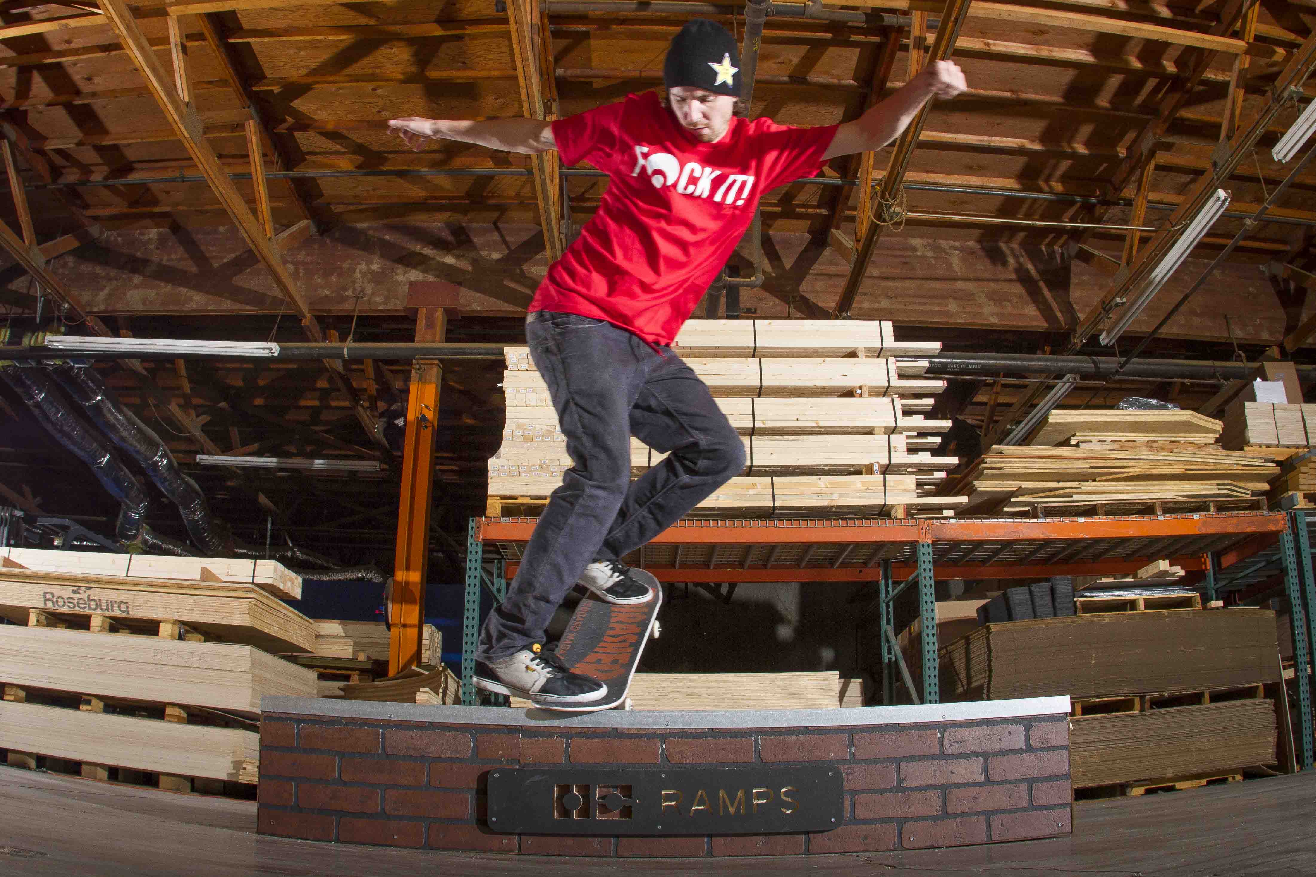 Skater using an OC Ramps brick grind box